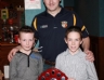 Paddy Richmond presents Oisin McLaughlin and Brian Og O'Neill with the Under 10 Hurling Championship 